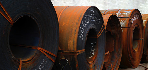 rolls of rusted sheet metal