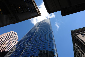 Fototapeta na wymiar looking up at the top of five skyscrapers