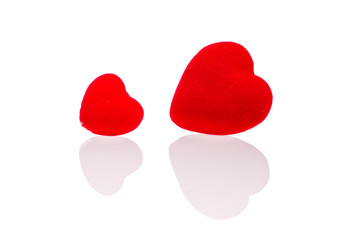 two red hearts and their reflection