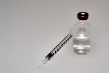 medicine vial and syringe