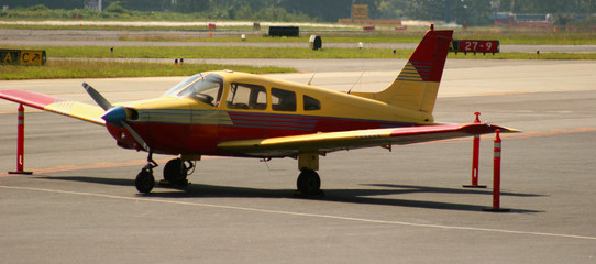 red and yellow plane