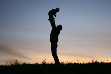 silhouette father with baby