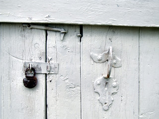 old door with a padlock and a handle