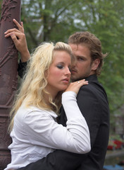 young embracing adult couple