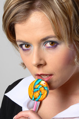 blond woman with lollipop