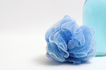 loofah and soap bottle