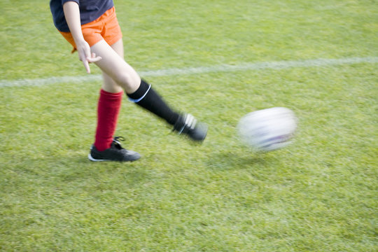 Girls Soccer Player Passing The Ball