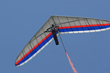 hanglider close up with smoke trail
