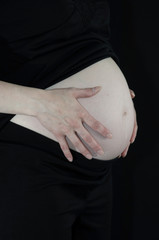 pregnant woman with black background