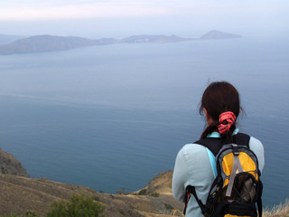 the girl, mountains and the sea.