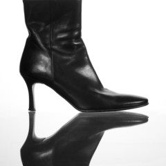 elegant black leather boot with high heels