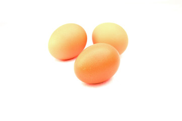 three brown eggs