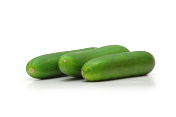 three cucumbers isolated on white