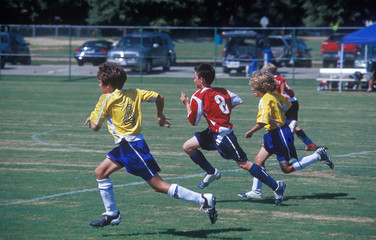 junior soccer / football - chasing the ball