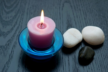 candle with stones