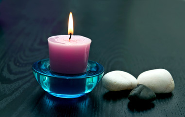 candle with stones