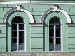 windows on a green wall