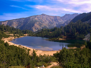 glacial lake with some mountains in the background