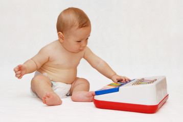 baby with piano toy