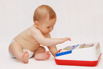 baby with piano toy