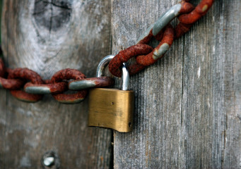 a lock and a rusty chain