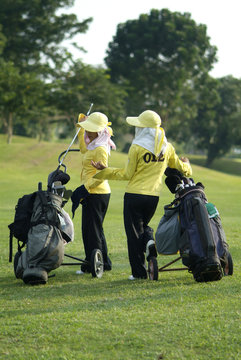 two caddies at a golf course