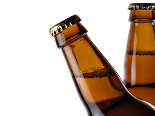 upper part of two beer bottles
