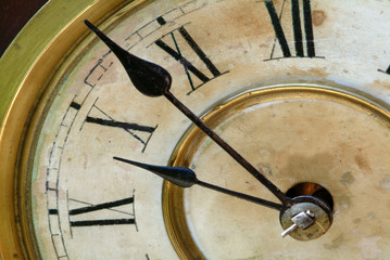 antique clock face with hands
