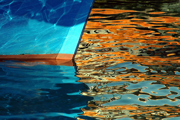 prow of boat in golden reflections