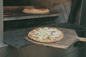 pizza comes from oven