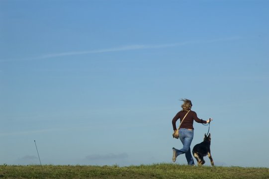 Girl Running With Dog