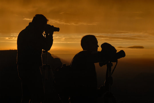 photographers silhuoettes at grand canyon, sunset