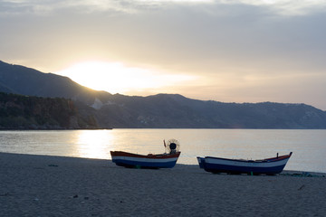 Fototapeta na wymiar fishing boats at the break of dawn