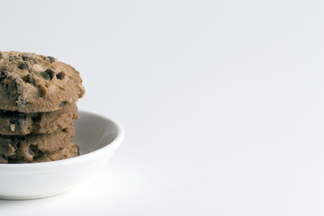 stack of chocolate chips cookies isolated on white