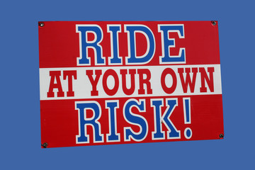 ride at your own risk sign