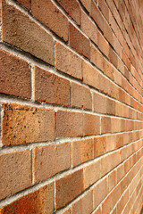 looking along a modern brick wall