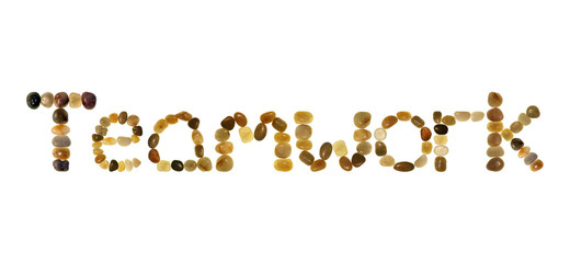 teamwork in colored pebbles on an isolated white b