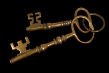 two brass keys (on black)