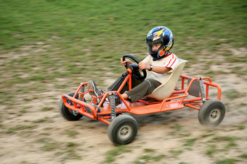 a boy rides kart