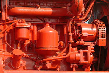 brightly painted red diesel engine