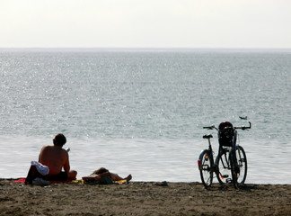 cyclists on beach