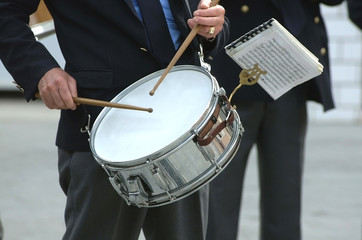 uniform musician playing drum