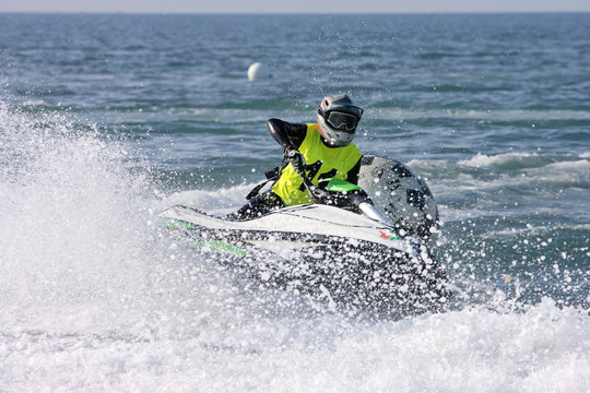 young man speeding along on jetbike during a race
