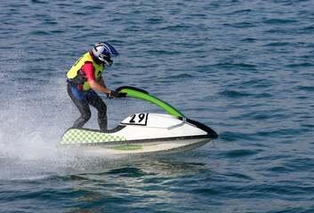 young man speeding along on jetbike during a race