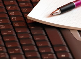 keyboard with pen in pink color scheme