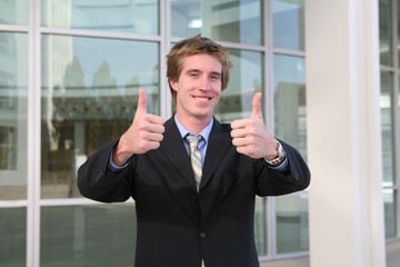 business man thumbs up (focus on thumbs)