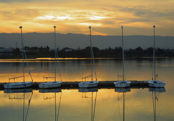 Sail boat docking at sunset time