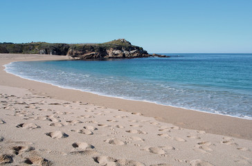 Fototapeta na wymiar clear and empty white sand beach with footprint