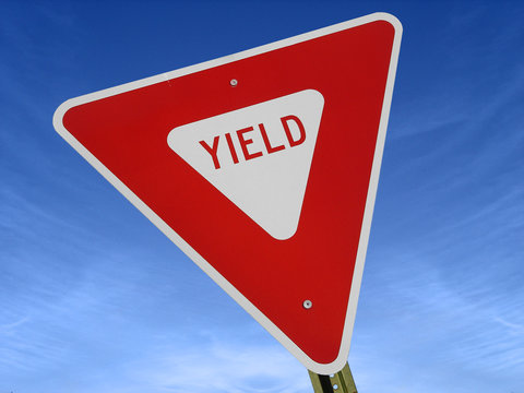 yield sign against blue sky