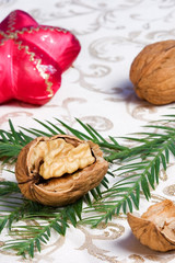 Obraz na płótnie Canvas christmas ornaments, walnuts and fir